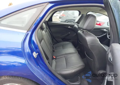 2014 Ford Focus Titanium z USA, uszkodzony, nr VIN 1FADP3J26EL253124